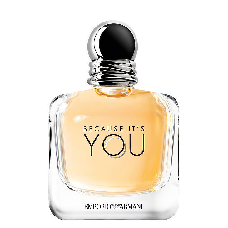 Emporio Armani Because It's You Eau de Parfum – en elegant glasflaska med rundade kanter och en mjukt persikofärgad vätska. Flaskan har en rund, mörk silverfärgad metallkork med dubbla ringar, stående mot en helt vit bakgrund.